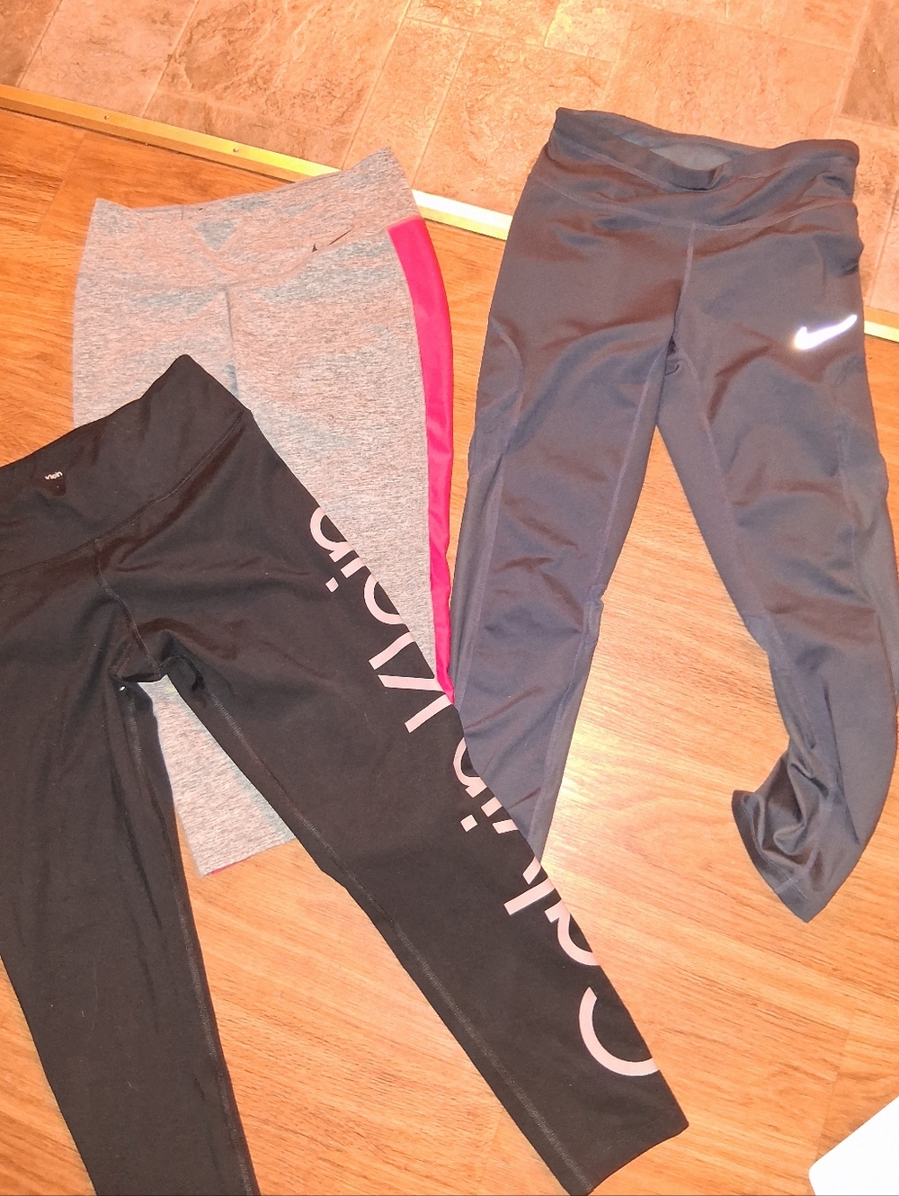 Three pairs size small yoga capris